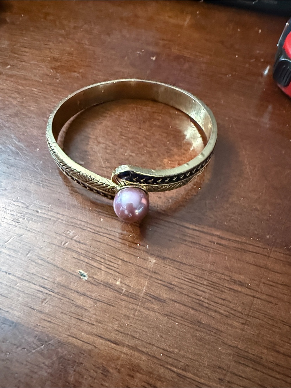 Gold Tone Bracelet with Pink Pearl Accent and Etched Detail